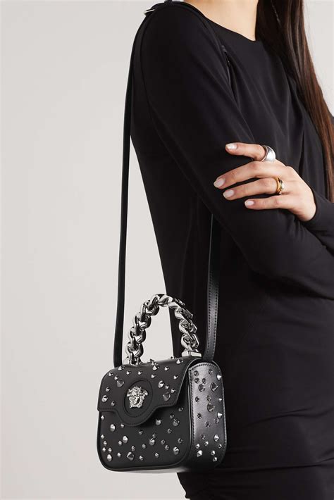 versace embellished leather shoulder bag.